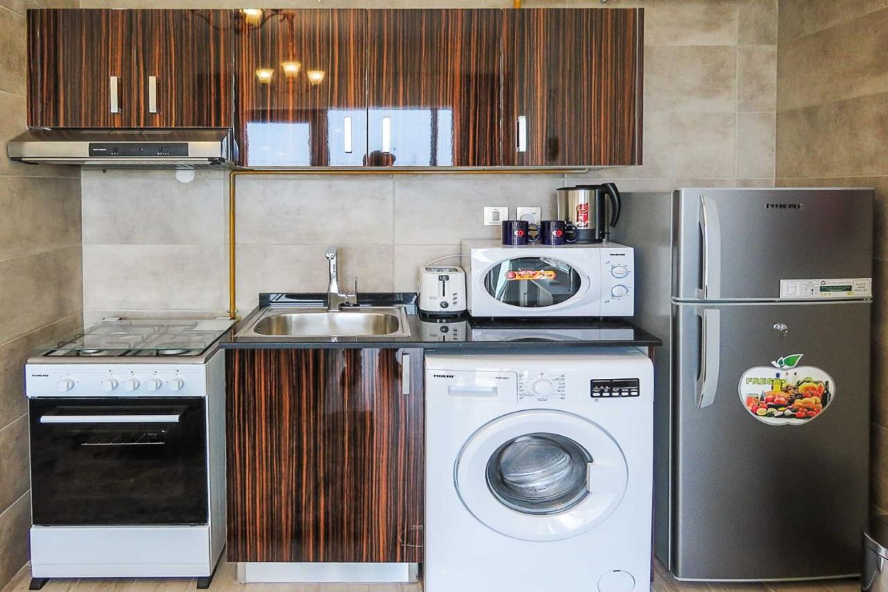 Oyo 860 Studio Apartment, Maya Tower 4, Jumeirah Village Triangle Дубай Экстерьер фото