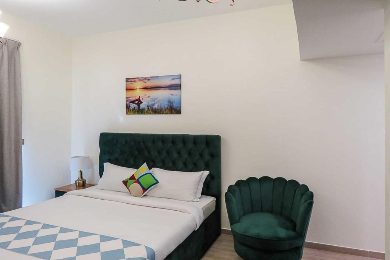 Oyo 860 Studio Apartment, Maya Tower 4, Jumeirah Village Triangle Дубай Экстерьер фото